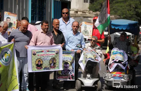 Palestinians hold banners during a protest to show solidarity with Palestinian prisoners on hunger strike in Israeli Jails, in front of the high commissioner for human rights headquarters in Gaza City, on Sept. 04, 2016....