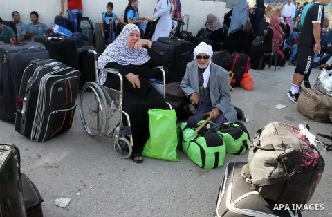 Palestinians wait for travel permits to cross into Egypt through the Rafah border crossing, on September 4, 2016 in the southern Gaza Strip. Egyptian authorities temporarily reopened it both directions for two days in Ga...
