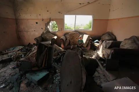 Palestinians from the al-Shanti family check the damage in their house after it was hit by Israeli tank fire on September 6, 2016 in Beit Hanun in the northern Gaza Strip. Israel's army targeted Hamas posts in the Gaza S...