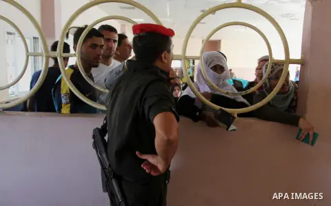 Palestinians wait for travel permits to cross into Egypt through the Rafah border crossing, on September 6, 2016 in the southern Gaza Strip. Egyptian authorities temporarily reopened it both directions in Gaza Strip, pat...