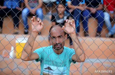 A Palestinian spectator watches Super Cup soccer match between Shabab Khan Younis and Khadamat Rafah, at Yarmouk Stadium in Gaza city, on Sep. 09, 2016. Photo by Ashraf Amra