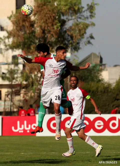 Palestinian Shabab Khan Younis players and Khadamat Rafah players compete during Super Cup soccer match at Yarmouk Stadium, in Gaza city on Sep. 09, 2016. Photo by Ashraf Amra