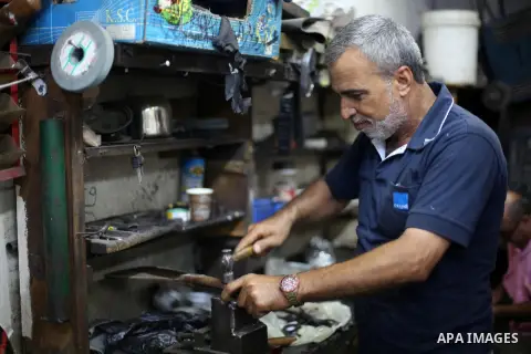 A Palestinian man sharpen knives at his workshop in Gaza city on Sept. 10, 2016. The knives use to slaughter cattle and sheep for the Muslim holiday of Eid al-Adha or the Feast of Sacrifice, which marks the end of the an...