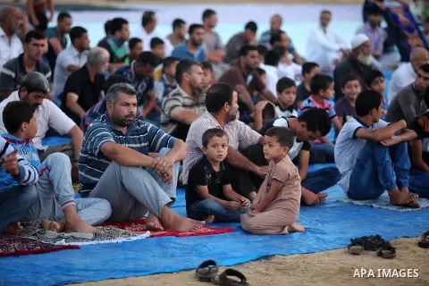 Palestinians attend the morning prayer of the Muslim holiday of the Eid al-Adha on September 12, 2016, in Khan Younis in the southern Gaza strip. Muslims across the world celebrate the annual festival of Eid al-Adha, or...
