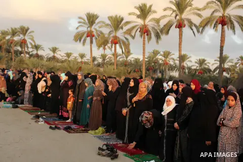 Palestinians attend the morning prayer of the Muslim holiday of the Eid al-Adha on September 12, 2016, in Khan Younis in the southern Gaza strip. Muslims across the world celebrate the annual festival of Eid al-Adha, or...