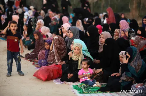 Palestinians attend the morning prayer of the Muslim holiday of the Eid al-Adha on September 12, 2016, in Khan Younis in the southern Gaza strip. Muslims across the world celebrate the annual festival of Eid al-Adha, or...