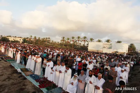 Palestinians attend the morning prayer of the Muslim holiday of the Eid al-Adha on September 12, 2016, in Khan Younis in the southern Gaza strip. Muslims across the world celebrate the annual festival of Eid al-Adha, or...