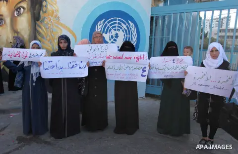 Palestinian teachers and graduates take part a protest demanding their rights in front of the headquarters United Nations Relief and Works Agency (UNRWA), in Gaza City, on Sept. 18, 2016. Photo by Ashraf Amra