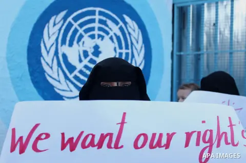 Palestinian teachers and graduates take part a protest demanding their rights in front of the headquarters United Nations Relief and Works Agency (UNRWA), in Gaza City, on Sept. 18, 2016. Photo by Ashraf Amra