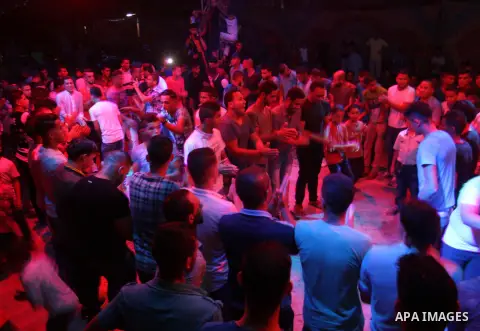 Palestinians celebrate during a traditional wedding party in Arabic "Henna's Night" in Rafah in the southern Gaza strip on Sep. 20, 2016. Palestinians perform the traditional dancing style derived from their folklore, th...