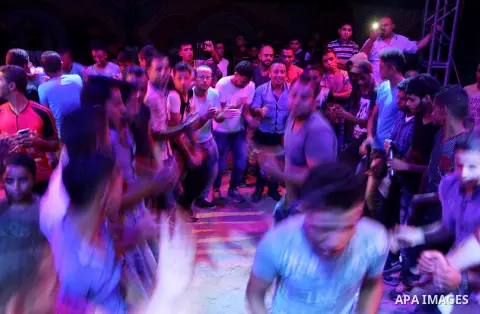 Palestinians celebrate during a traditional wedding party in Arabic "Henna's Night" in Rafah in the southern Gaza strip on Sep. 20, 2016. Palestinians perform the traditional dancing style derived from their folklore, th...