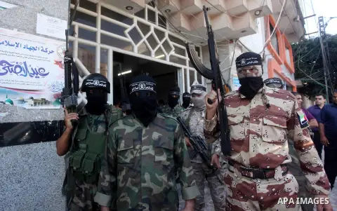Palestinian militants of the Nasser Salah al-Din Brigades the military wing of the Popular Resistance movement take part in a press conference, in Gaza City on Sept. 27, 2016. Photo by Ashraf Amra