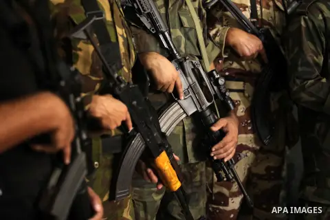 Palestinian militants of the Nasser Salah al-Din Brigades the military wing of the Popular Resistance movement take part in a press conference, in Gaza City on Sept. 27, 2016. Photo by Ashraf Amra