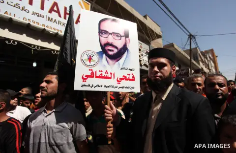 Palestinian supporters of the Islamic Jihad Movement take part in a demonstration marking the first anniversary of the so-called Al-Quds uprising in Gaza city, on October 2, 2016. Photo by Ashraf Amra