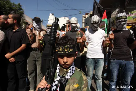 Palestinian supporters of the Islamic Jihad Movement take part in a demonstration marking the first anniversary of the so-called Al-Quds uprising in Gaza city, on October 2, 2016. Photo by Ashraf Amra