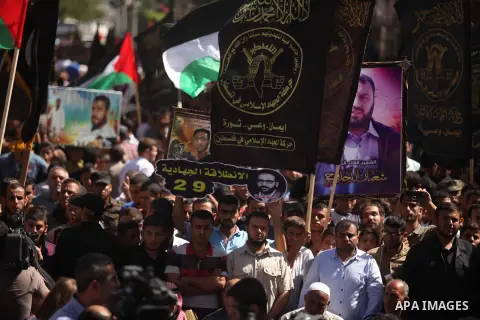 Palestinian supporters of the Islamic Jihad Movement take part in a demonstration marking the first anniversary of the so-called Al-Quds uprising in Gaza city, on October 2, 2016. Photo by Ashraf Amra