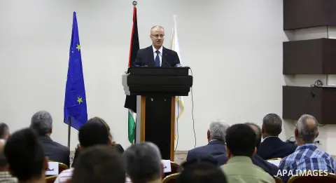 Palestinian Prime Minister, Rami Hamdallah, attends the launch of the national plan for sustainable production and consumption, in the West bank city of Ramallah, Oct. 05, 2016. Photo by Prime Minister Office