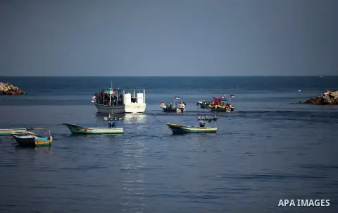 Palestinians show their solidarity with a Gaza-bound flotilla of international activists attempting to break the Israeli blockade on the Hamas-run Gaza Strip, on October 5, 2016 at the port in Gaza City. A group of women...