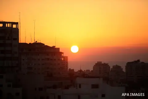 The sunset are seen above port of Gaza City on October 5, 2016. Photo by Ashraf Amra