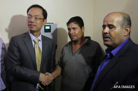 Chinese Ambassador to Palestine, Chen Zhong Xing and former Palestinian chief negotiator and member of the Central Committee of Fatah, Nabil Shaath open the project of Lighting solar homes, in Khan Younis in the southern...