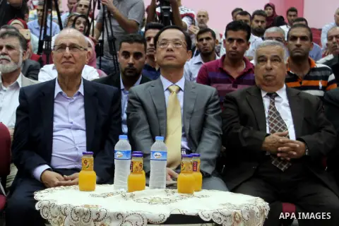 Chinese Ambassador to Palestine, Chen Zhong Xing and former Palestinian chief negotiator and member of the Central Committee of Fatah, Nabil Shaath attend the ceremony of opening the project of Lighting solar homes, in K...