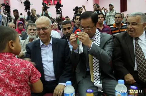 Chinese Ambassador to Palestine, Chen Zhong Xing and former Palestinian chief negotiator and member of the Central Committee of Fatah, Nabil Shaath attend the ceremony of opening the project of Lighting solar homes, in K...
