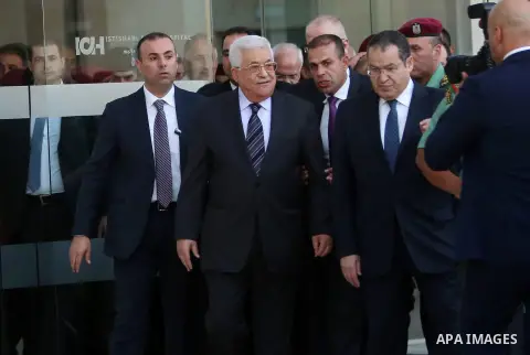 Palestinian President Mahmoud Abbas leaves the hospital in the West Bank city of Ramallah, October 6, 2016. Photo by Shadi Hatem