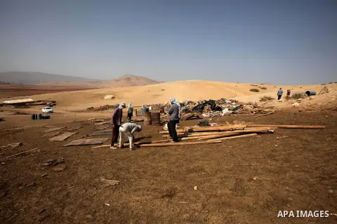 Palestinians inspect the remains of a house after it was demolished by Israeli authorities who said it was built without municipal permission on October 9, 2016 in the West Bank village of Khirbet ar-Ras al-Ahmar, north...