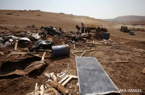 Palestinians inspect the remains of a house after it was demolished by Israeli authorities who said it was built without municipal permission on October 9, 2016 in the West Bank village of Khirbet ar-Ras al-Ahmar, north...