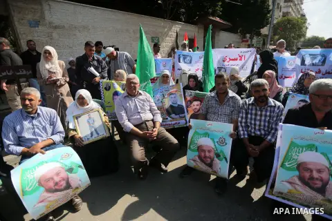 Palestinians take part during a protest to show solidarity with Palestinian prisoners on hunger strike in Israeli Jails, in front of Red cross office in Gaza city, on Oct. 10, 2016. Photo by Mohammed Asad
