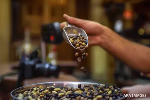 An Egyptian man makes a coffee at a factory, in Cairo, Egypt on October 11, 2016. The shop of Abdul Salam Al-banan is one of the oldest shops of the coffee industry in Egypt. Photo by Amr Sayed