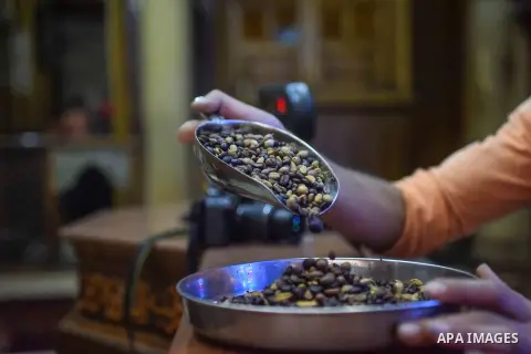 An Egyptian man makes a coffee at a factory, in Cairo, Egypt on October 11, 2016. The shop of Abdul Salam Al-banan is one of the oldest shops of the coffee industry in Egypt. Photo by Amr Sayed