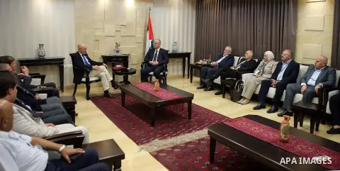 Palestinian Prime Minister Rami hamdallah meets with Secretary-General of the United Nations competent assistant sports affairs and development, Wilfried Lemke, in the West Bank city of Ramallah on October 12, 2016. Phot...