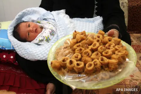 Tahany Shaath holds her three-day-old new-born son Waleed at their house in the southern Gaza Strip town of Rafah on October 12, 2016. The two millionth person has been born in Gaza, with the birth Waleed officially reco...