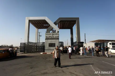 Palestinians wait for travel permits to cross into Egypt through the Rafah border crossing on October 15, 2016 in the southern Gaza Strip. Egyptian authorities temporarily reopened the crossing both directions for two da...