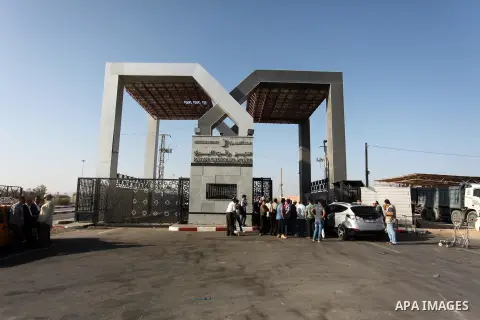 Palestinians wait for travel permits to cross into Egypt through the Rafah border crossing on October 15, 2016 in the southern Gaza Strip. Egyptian authorities temporarily reopened the crossing both directions for two da...
