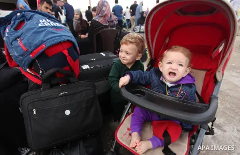 Palestinians wait for travel permits to cross into Egypt through the Rafah border crossing on October 15, 2016 in the southern Gaza Strip. Egyptian authorities temporarily reopened the crossing both directions for two da...