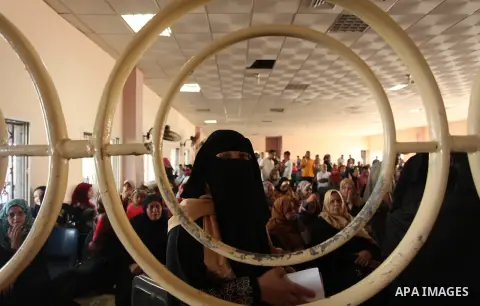 Palestinians wait for travel permits to cross into Egypt through the Rafah border crossing on October 15, 2016 in the southern Gaza Strip. Egyptian authorities temporarily reopened the crossing both directions for two da...