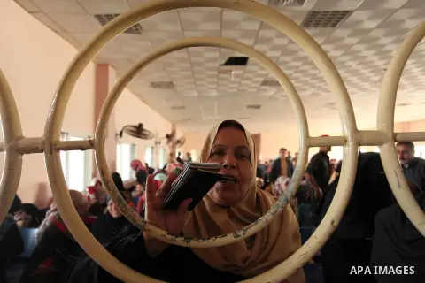 Palestinians wait for travel permits to cross into Egypt through the Rafah border crossing on October 15, 2016 in the southern Gaza Strip. Egyptian authorities temporarily reopened the crossing both directions for two da...