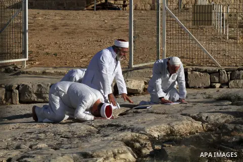Samaritans pray on top of Mount Gerizim near the northern West Bank city of Nablus on October 17, 2016 during Sukkot (Tabernacles) celebrations. Sukkot marks the exodus of the ancient Hebrew people from Egypt. The Samari...