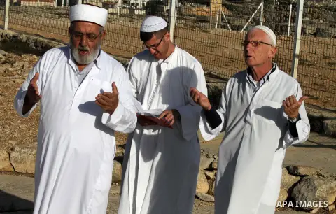 Samaritans pray on top of Mount Gerizim near the northern West Bank city of Nablus on October 17, 2016 during Sukkot (Tabernacles) celebrations. Sukkot marks the exodus of the ancient Hebrew people from Egypt. The Samari...