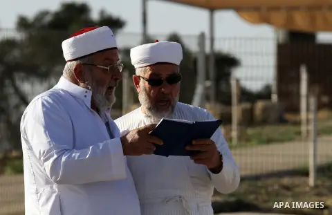 Samaritans pray on top of Mount Gerizim near the northern West Bank city of Nablus on October 17, 2016 during Sukkot (Tabernacles) celebrations. Sukkot marks the exodus of the ancient Hebrew people from Egypt. The Samari...