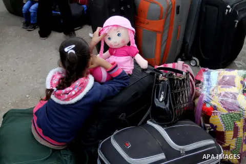 Palestinians wait for travel permits to cross into Egypt through the Rafah border crossing after it was opened by Egyptian authorities for humanitarian cases, in Rafah in the southern Gaza Strip October 19, 2016. Photo b...