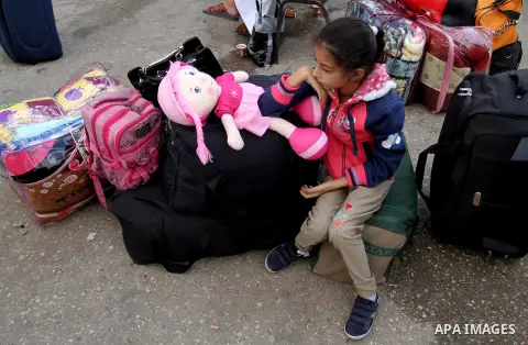 Palestinians wait for travel permits to cross into Egypt through the Rafah border crossing after it was opened by Egyptian authorities for humanitarian cases, in Rafah in the southern Gaza Strip October 19, 2016. Photo b...