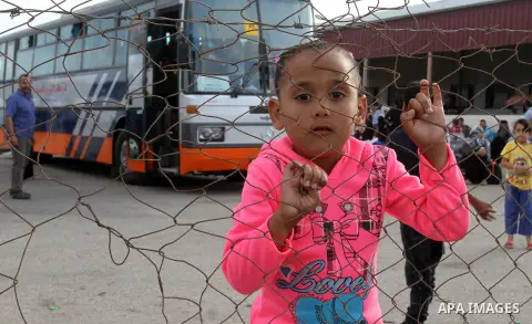 Palestinians wait for travel permits to cross into Egypt through the Rafah border crossing after it was opened by Egyptian authorities for humanitarian cases, in Rafah in the southern Gaza Strip October 19, 2016. Photo b...