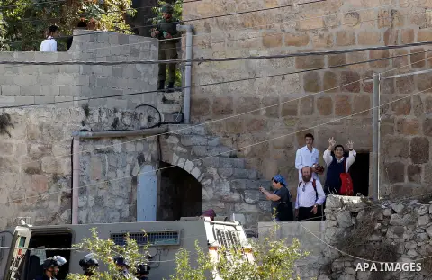 Ultra-Orthodox Jewish visit the Jewish shrine of Atnaeil Ben Kinaz during the Jewish Sukkot holiday or the feast of the Tabernacles in a Palestinian neighbourhood of the divided West Bank city of Hebron on Oct. 19, 2016....