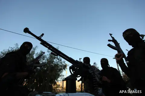 Palestinian Islamic Jihad militants hold their weapons during a military parade marking the 29 anniversary of their group in Gaza October 19, 2016. Photo by Ashraf Amra