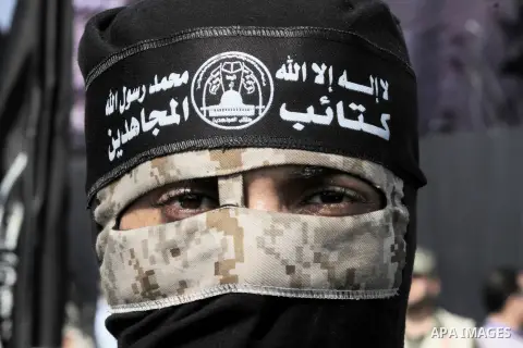 A Palestinian Islamic Jihad militant stands guard during a rally marking the 29th anniversary of the movement foundation in Gaza City October 21, 2016. Photo by Abed Rahim Khatib