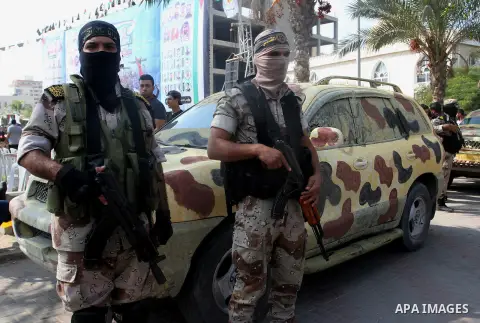 Palestinian Islamic Jihad militants stand guard during a rally marking the 29th anniversary of the movement foundation in Gaza City October 21, 2016. Photo by Abed Rahim Khatib