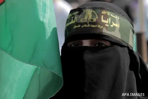 A Palestinian woman attends a rally marking the 29th anniversary of the foundation of the Islamic Jihad movement in Gaza City October 21, 2016. Photo by Abed Rahim Khatib